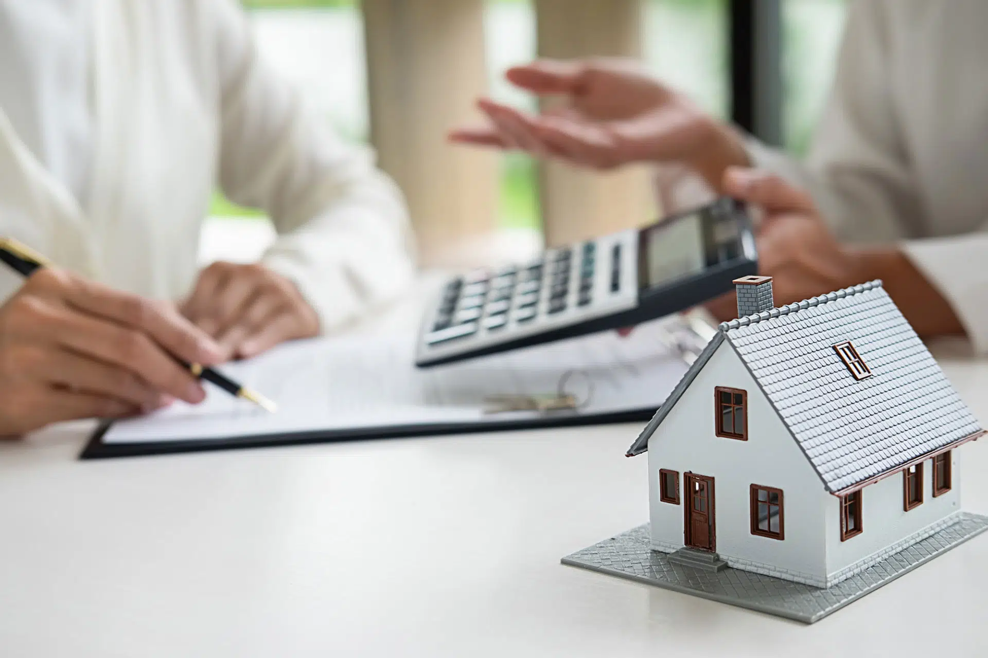 Real estate seller calculating home value